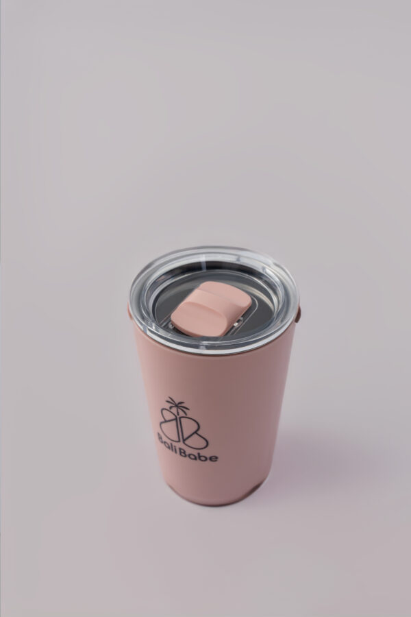 a pink cup with a lid